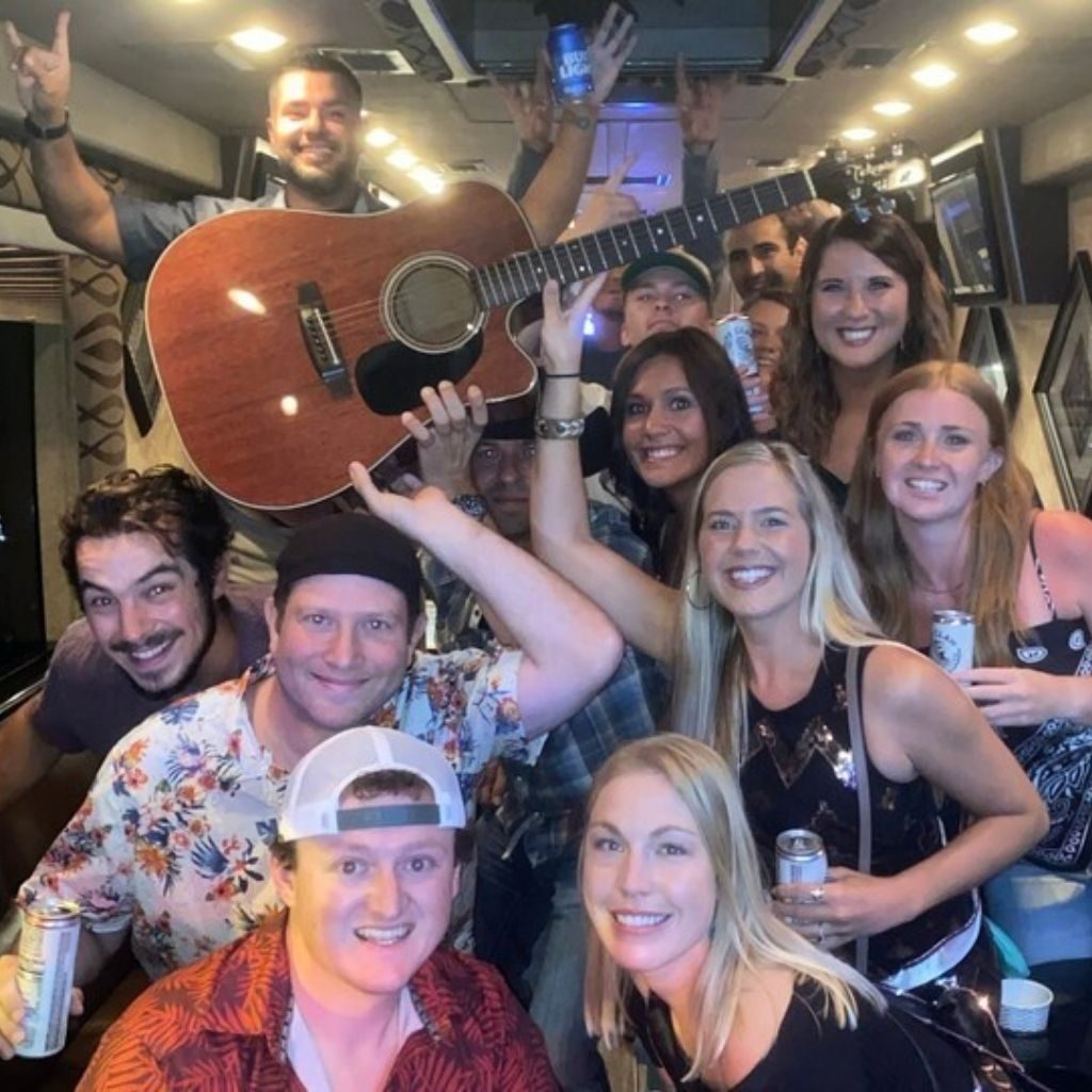 People having fun on their bus tour provided by Gig Tours